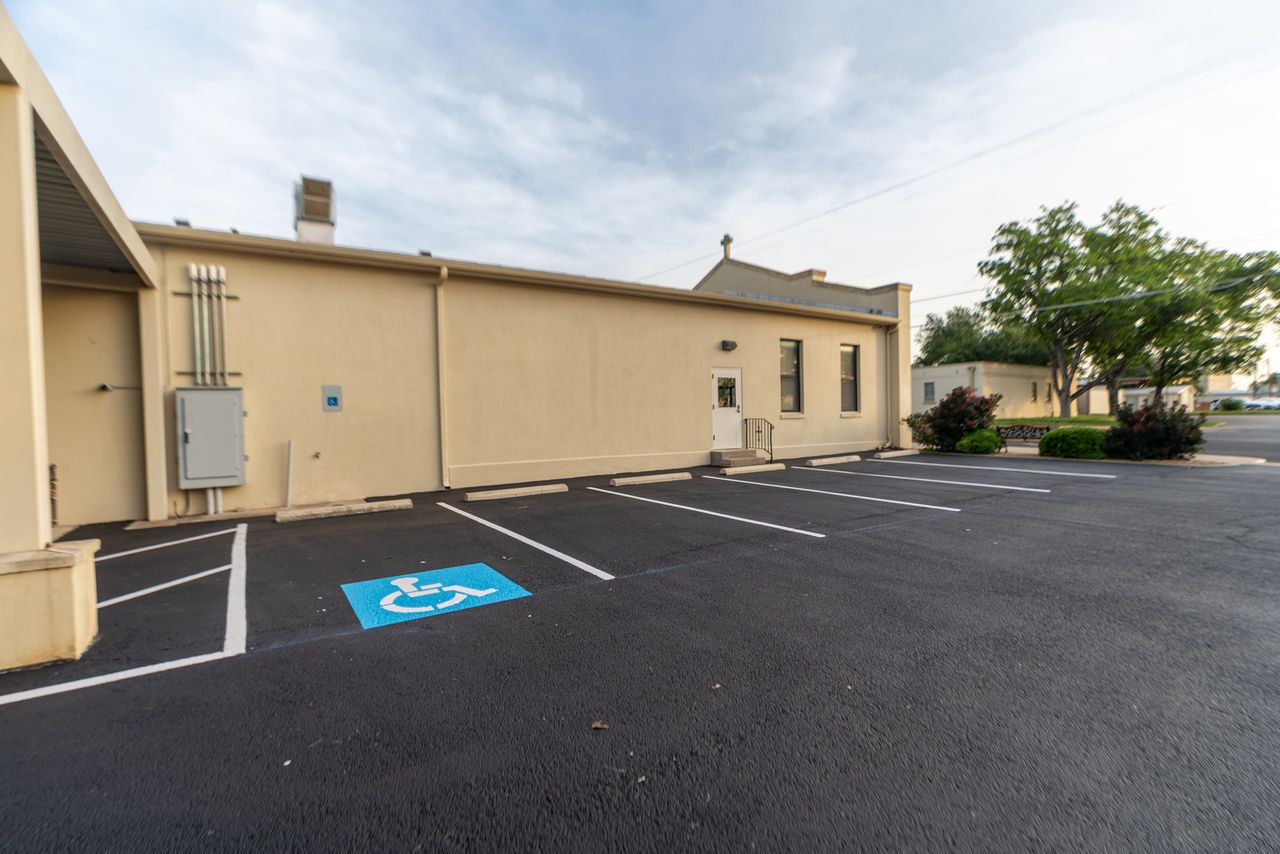 Striped accessible parking spaces on a finished surface