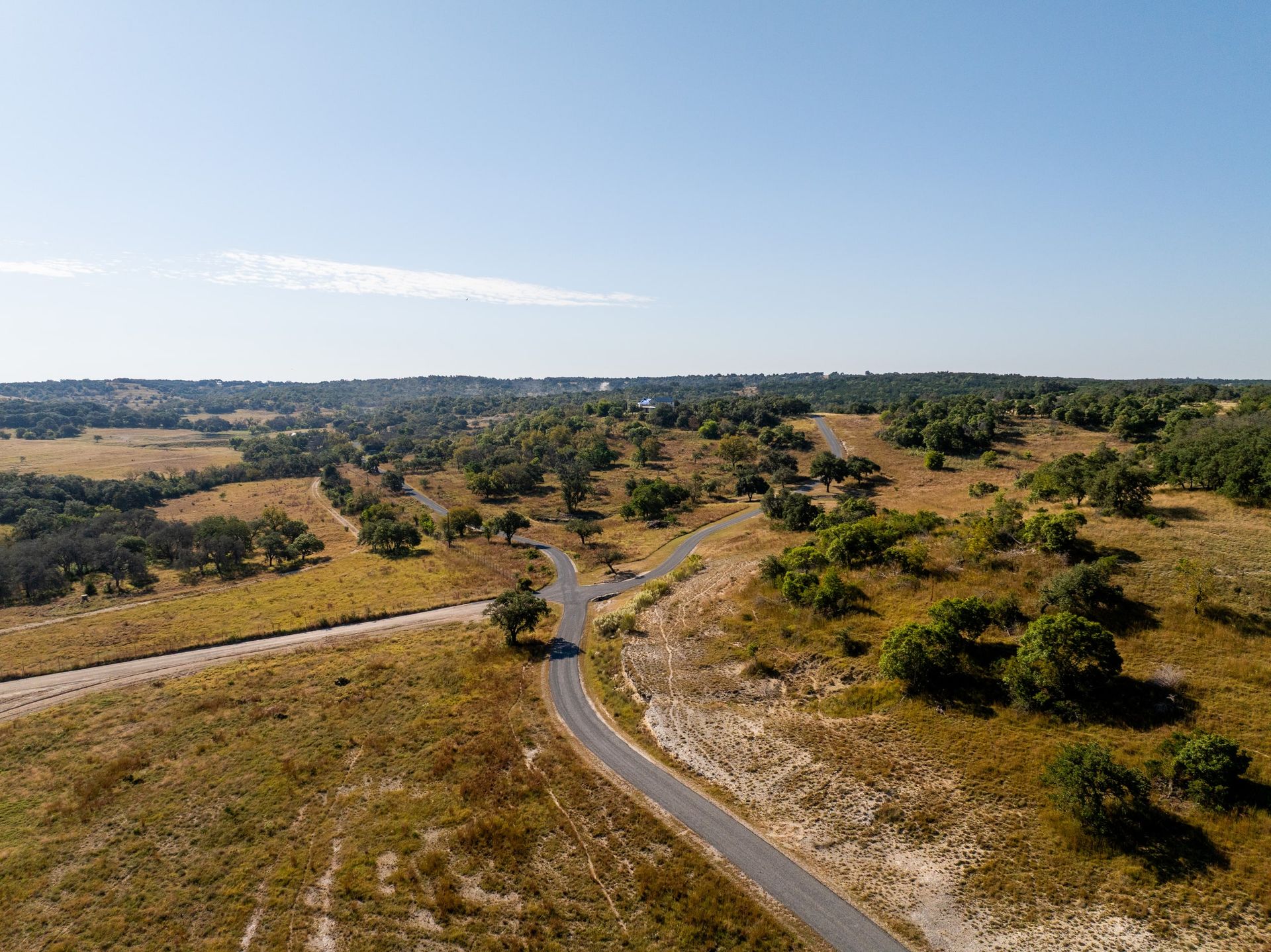 Aerial view of a branching road network across a rural property