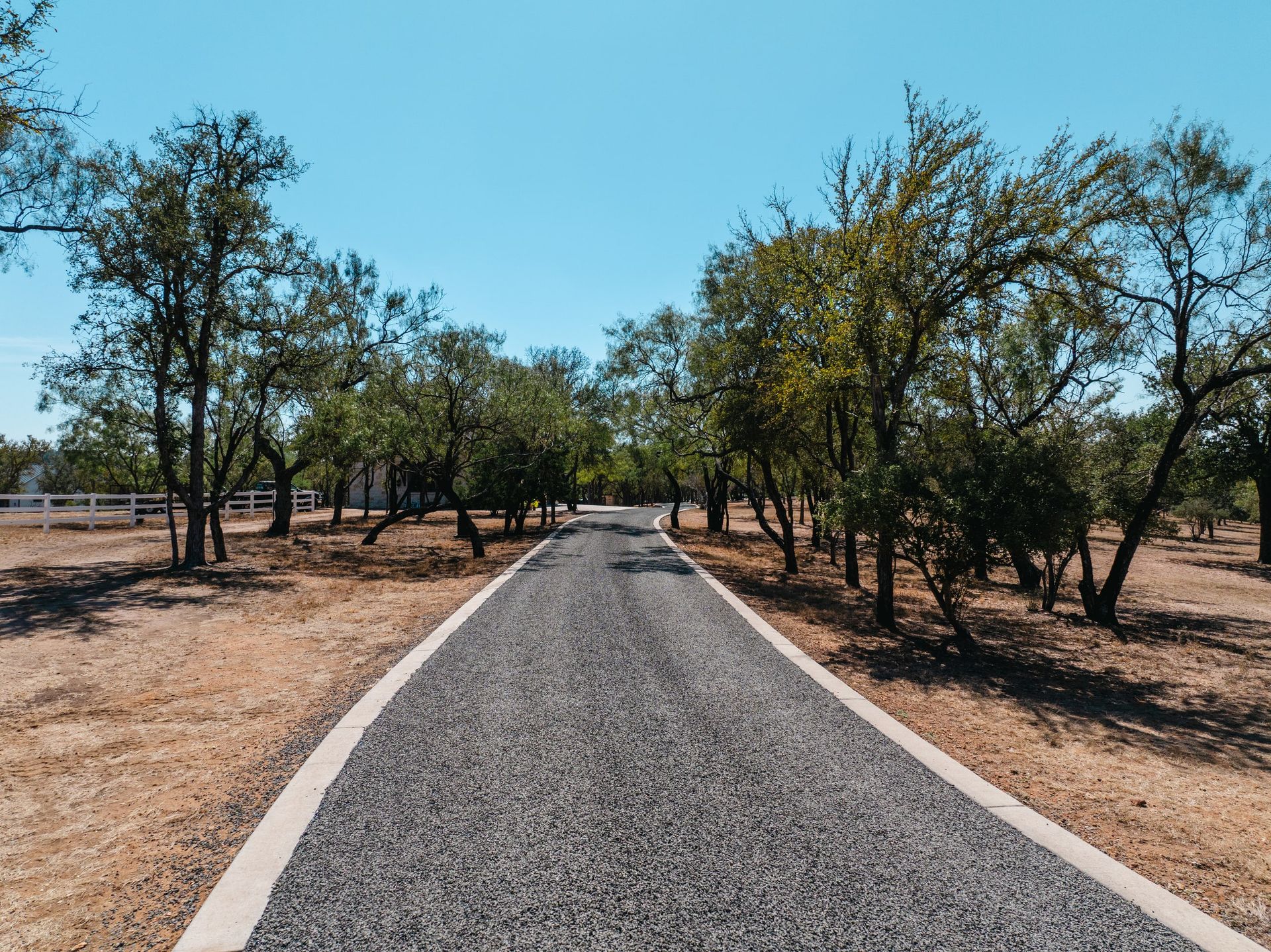 Finished chip-seal road with visible aggregate texture