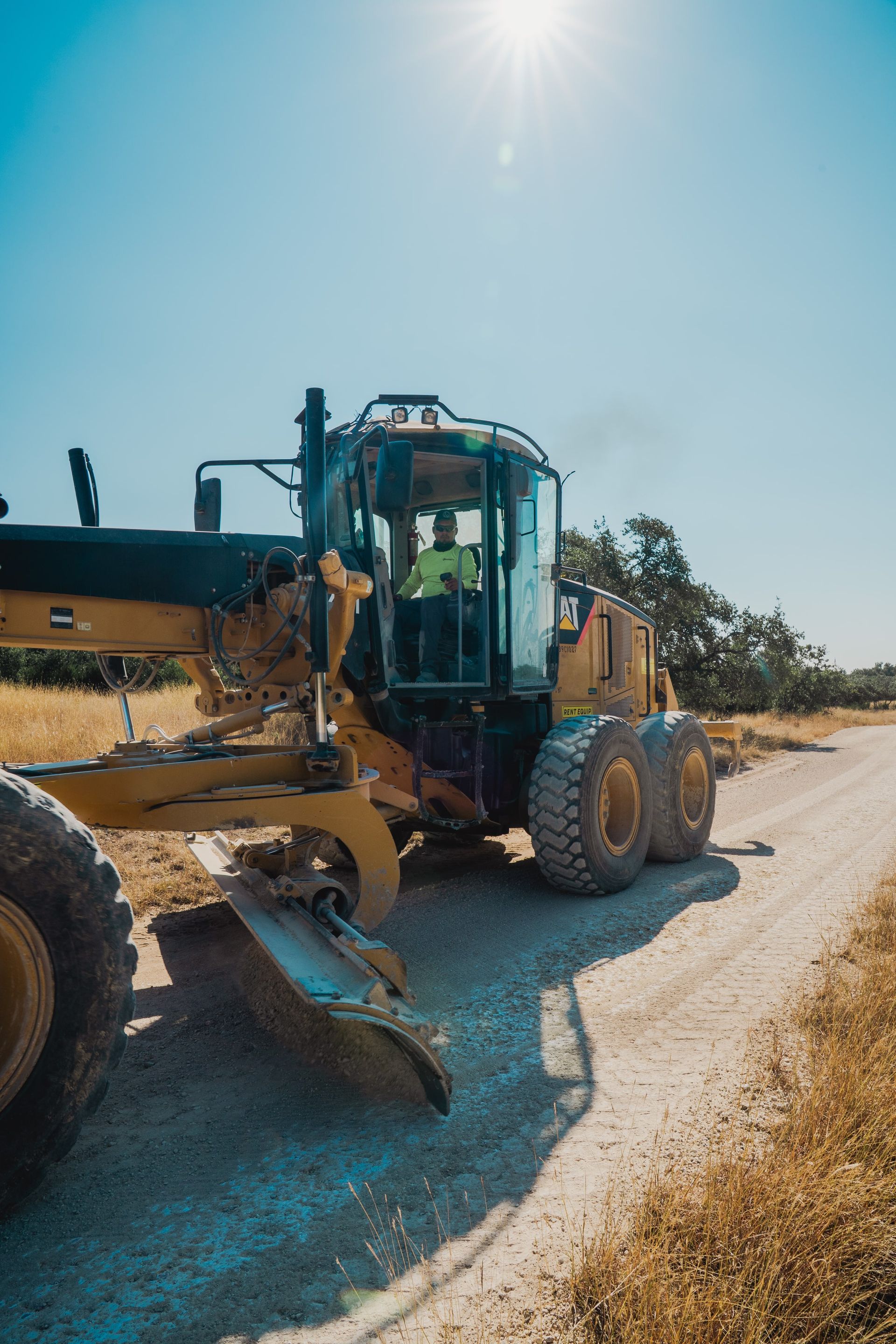 Motor grader shaping a rural road base