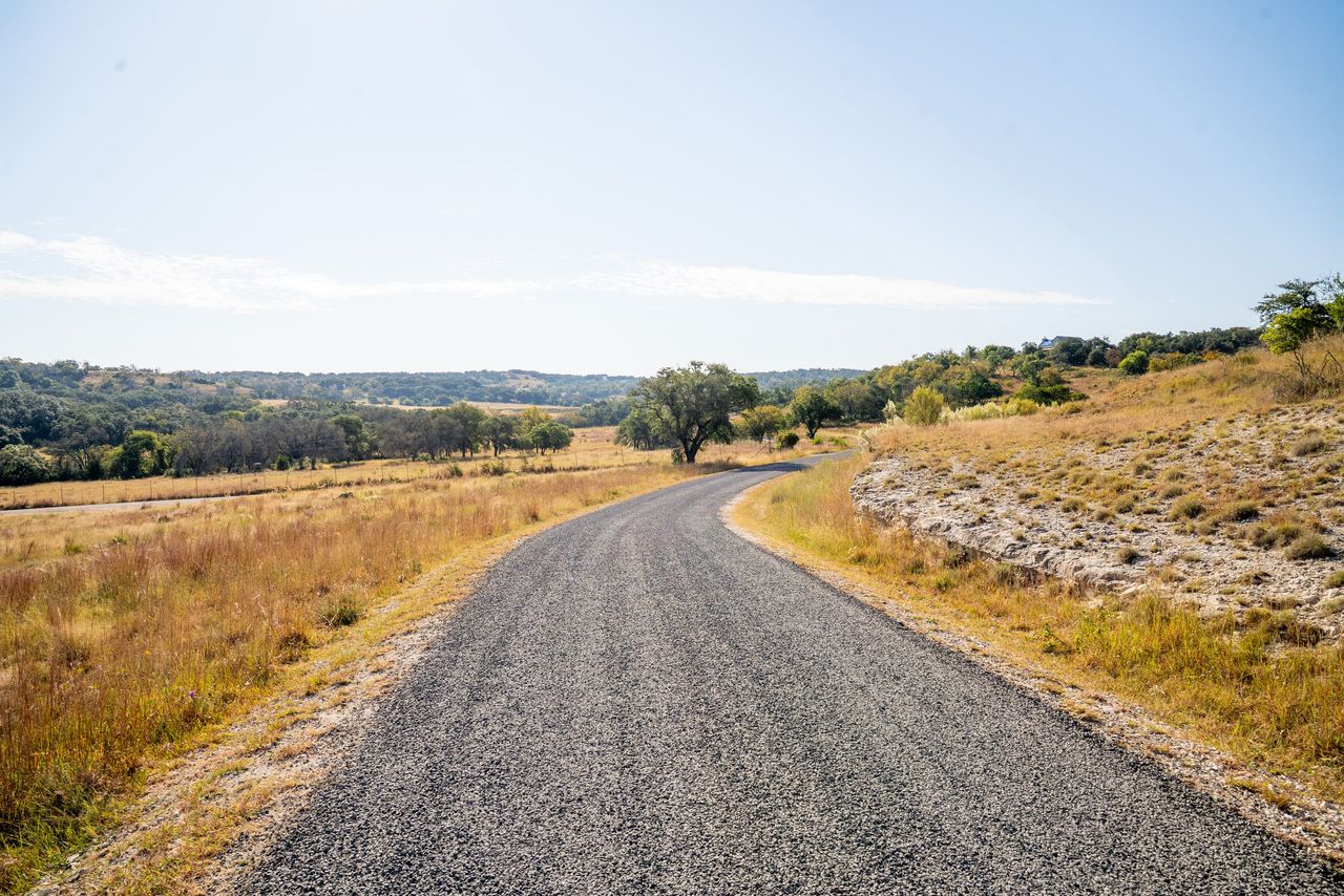 Uniform aggregate surface on the same curving rural road after work