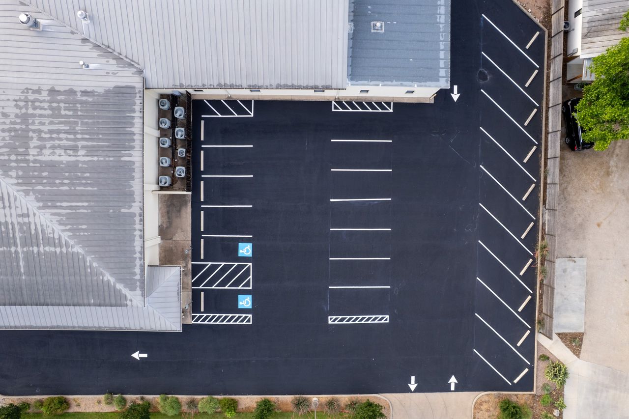 Overhead view of a finished and striped parking area