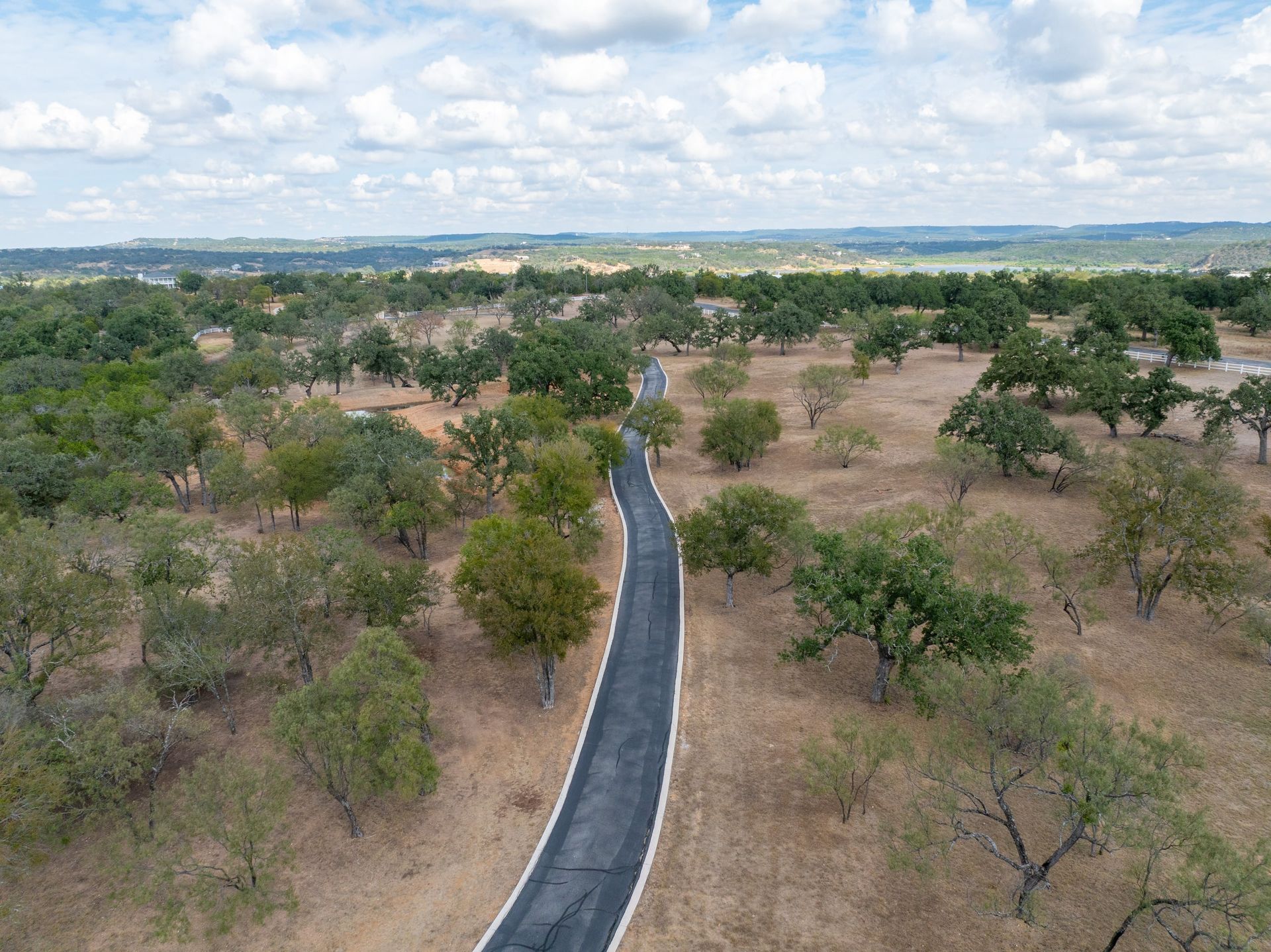Aerial view of a private road network through wooded terrain