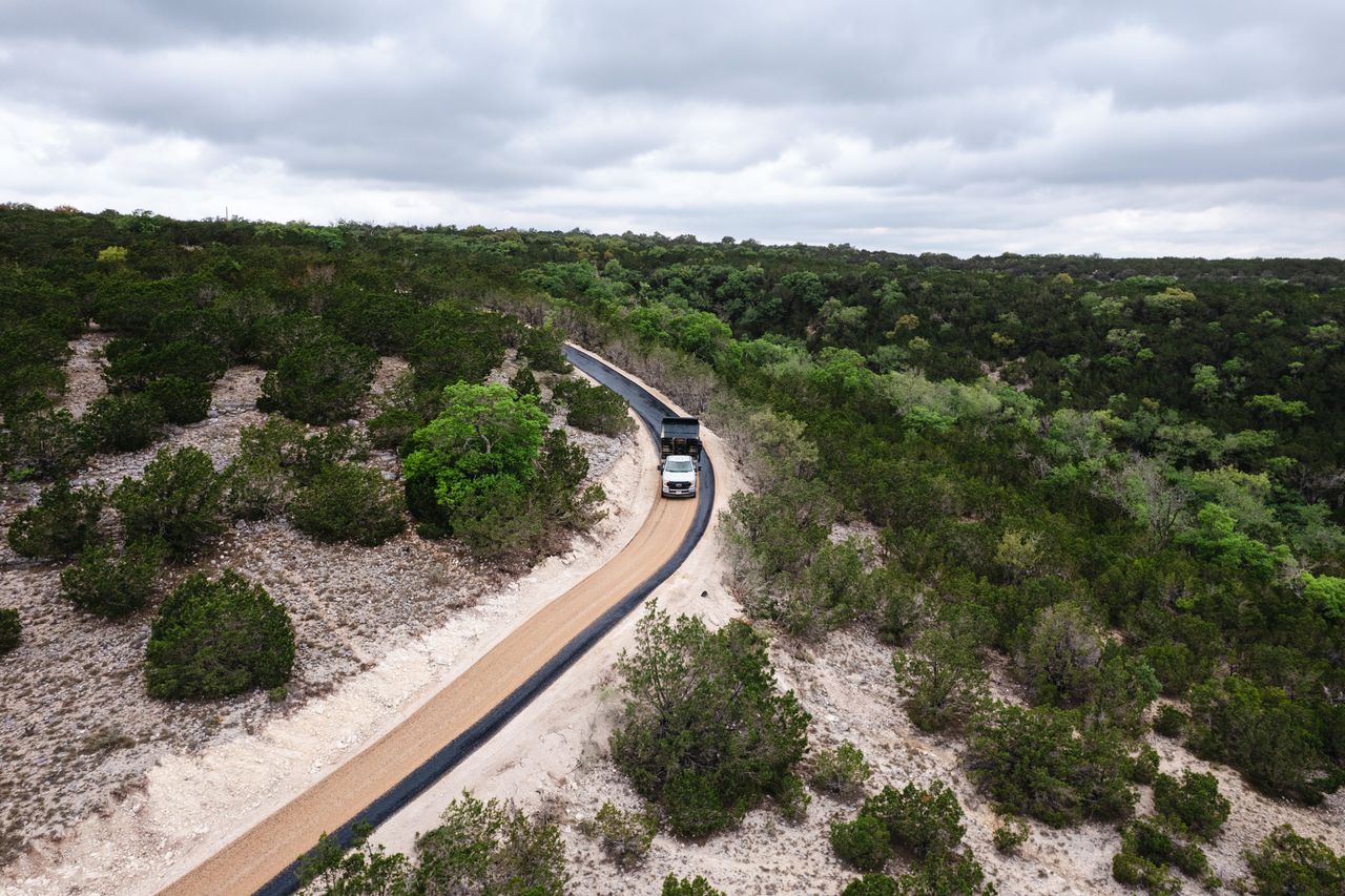 Aerial view of a long rural road in progress