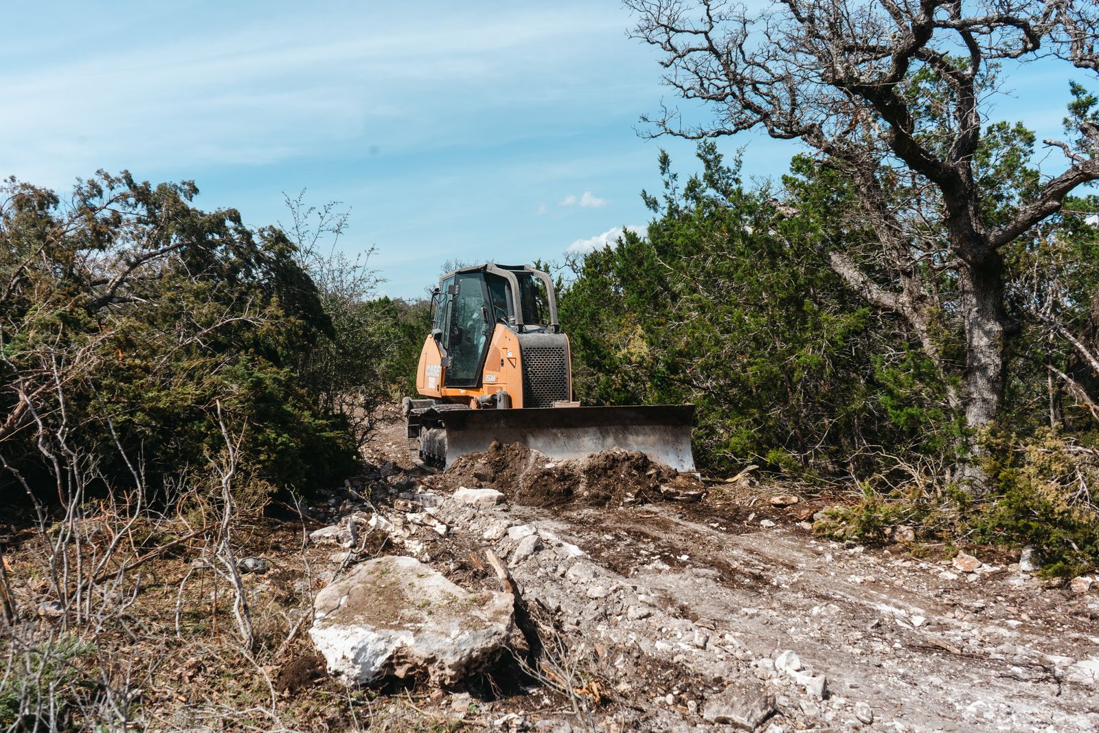 Road-base correction work on a rocky rural route