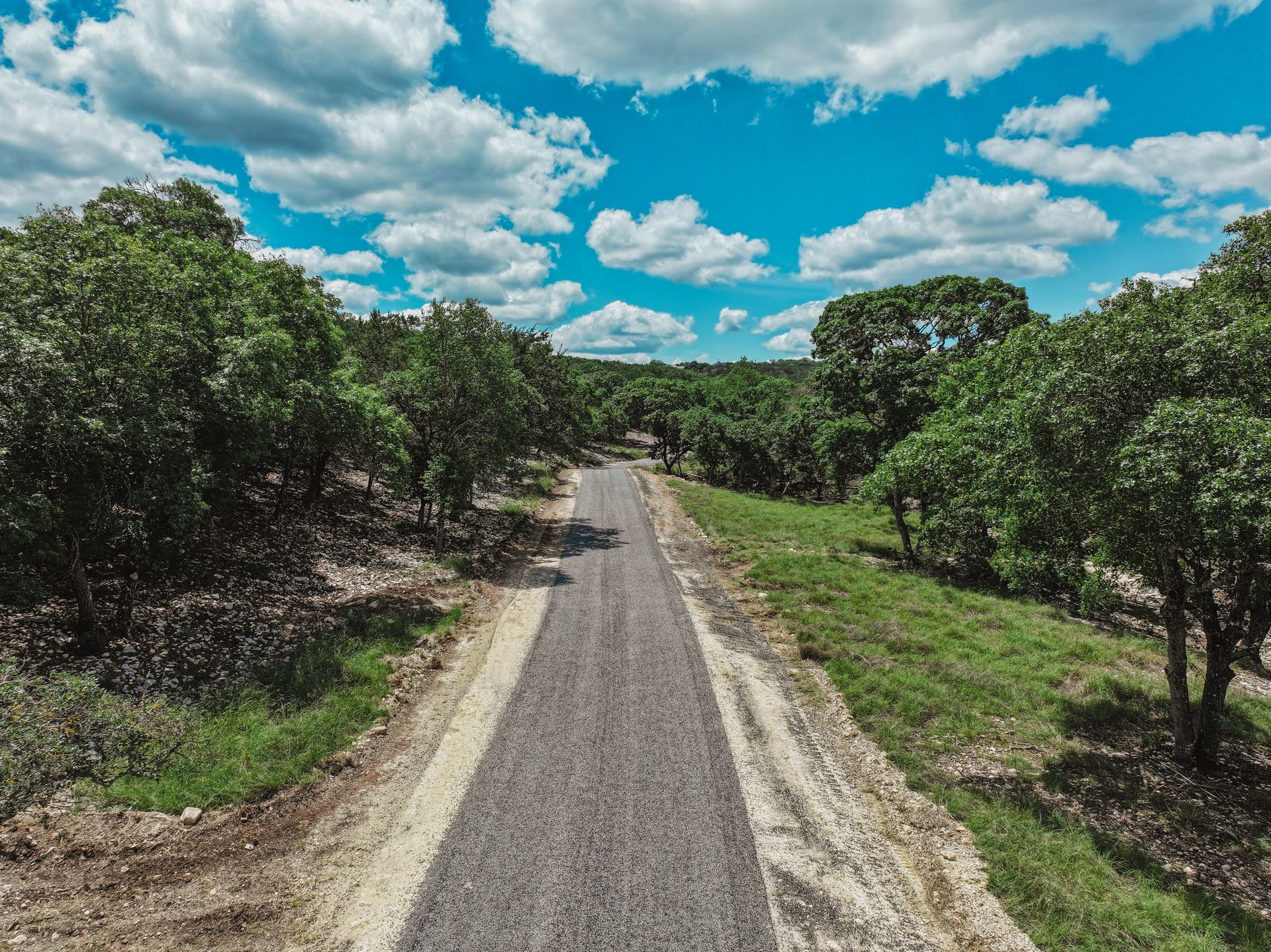 Aerial view of a rural road under surface preparation