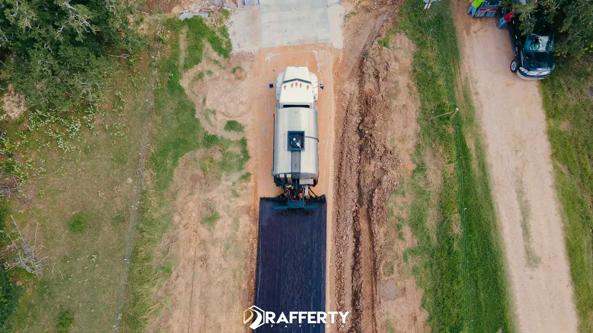 chip seal application on a ranch road in Kerr County, Texas.