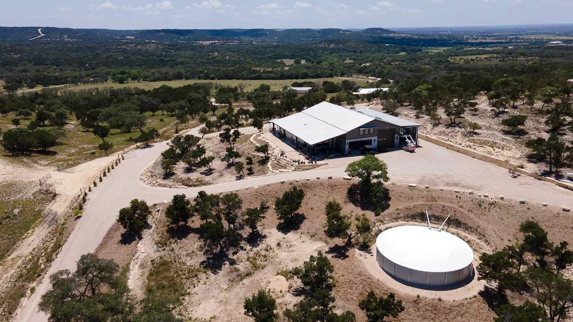 Freshly paved residential driveway by Rafferty Paving in the Texas Hill Country.