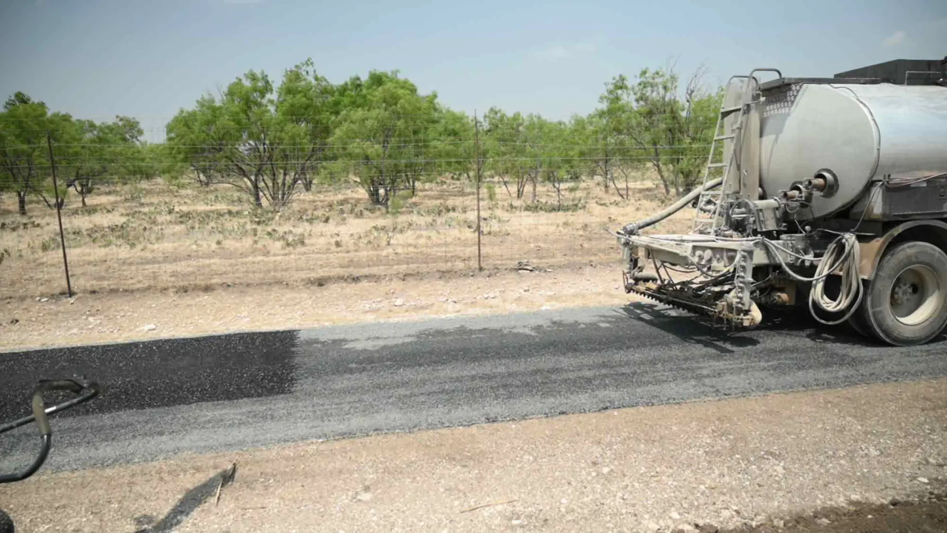 Professional asphalt paving crew at work on a driveway in Kerrville, TX.