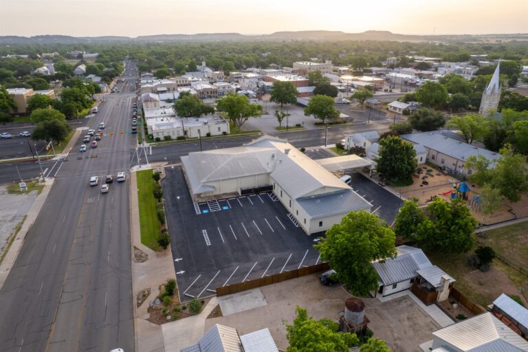 Aerial view of a freshly paved and striped parking lot by Rafferty Paving