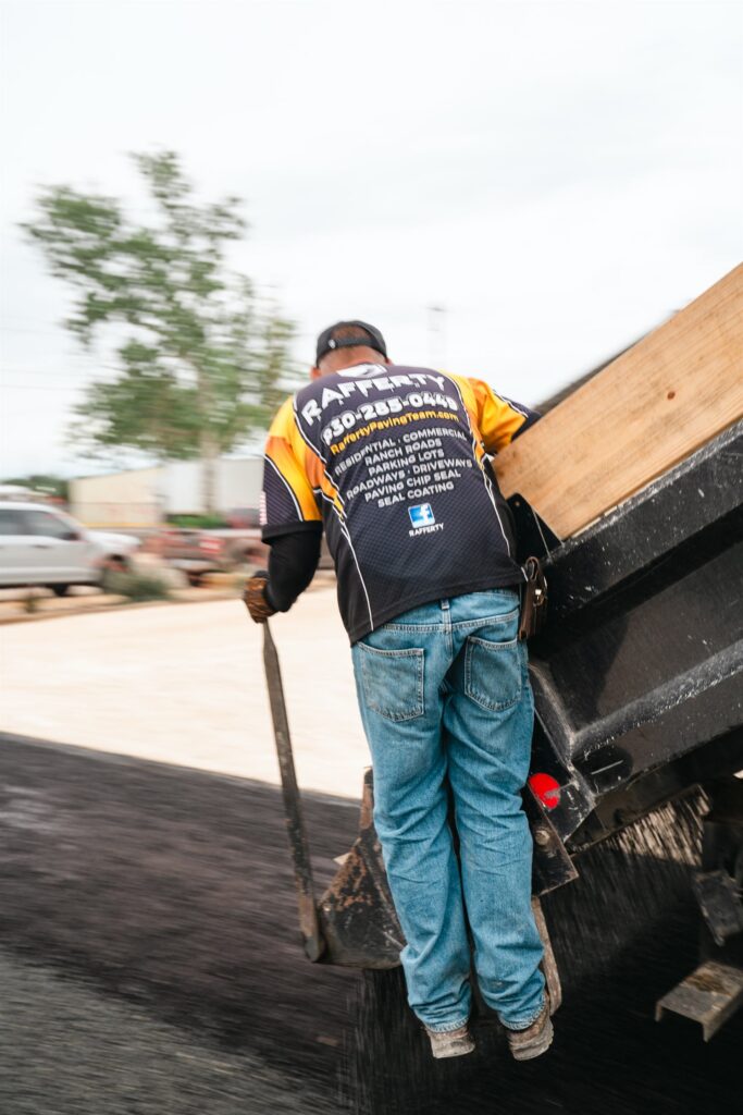 Rafferty Paving crew member working on a paving job