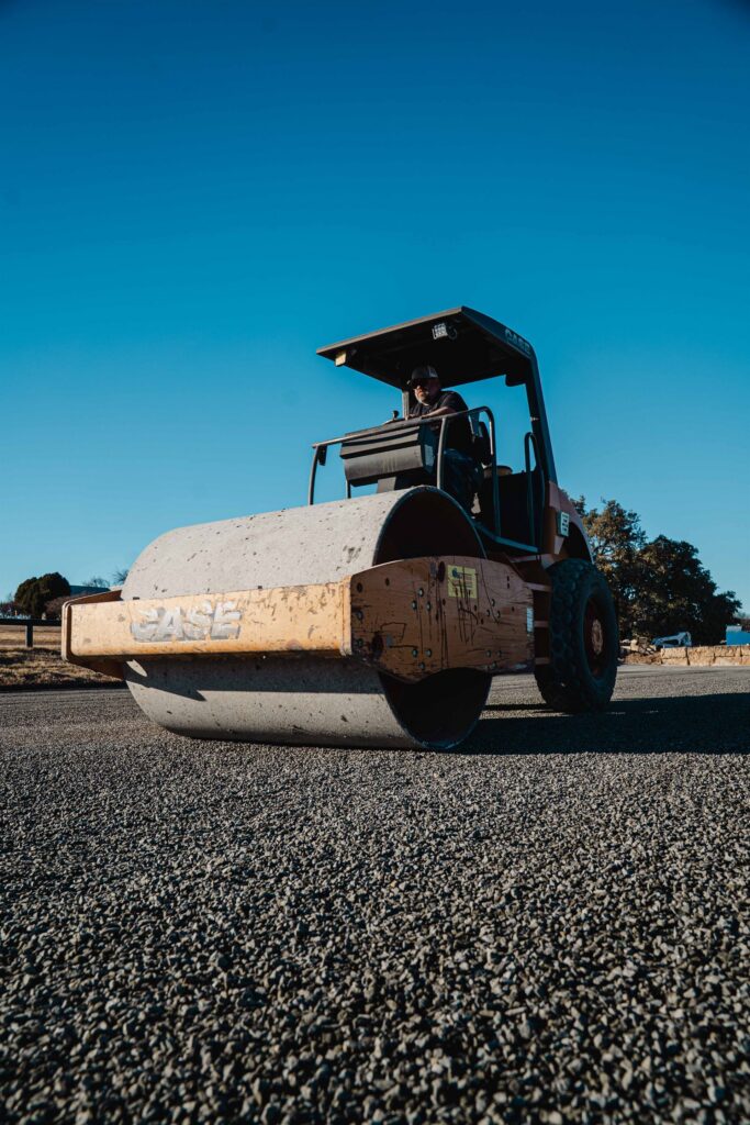 Chip seal aggregate spreading from a Rafferty Paving truck