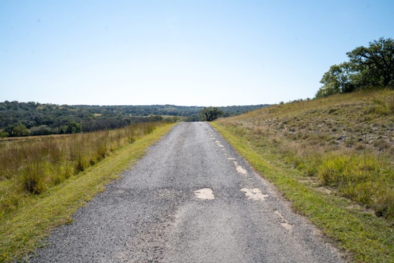 Worn country road before repair and resurfacing